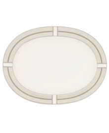 Metallic bronze lines meet and curve to create the sleek geometric pattern framing this oval serving platter from Noritake's collection of serveware and serving dishes. Crafted in durable bone china and trimmed with platinum for fine dining or everyday use.