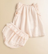 Rows of fluffy ruffles add charm to a sweet woven cotton frock with a gently flared shape.Elasticized gathered necklineSleeveless with ruffled trim at arm openingsKeyhole button-and-loop back closeMatching ruffled bloomers with elasticized waist and leg openingsCottonMachine washImported