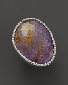 Diamonds circle a faceted purple charoite in a blackened sterling silver band. By Di Massima.