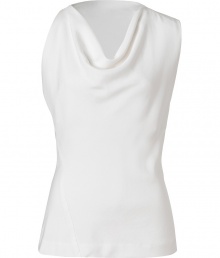 Lend a contemporary edge to polished day and evening looks alike with Donna Karans pristine white sculptural top - Draped neckline, asymmetrical sleeveless top - Form-fitting - Wear with a bright skirt, a blazer and pin heels