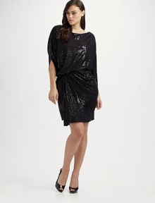 Draped, sequined knit, slightly gathered at the side with slit dolman sleeves for a glamorous silhouette.Boatneck Gathered shoulders Set-in waist Pullover style Fully lined About 39 from shoulder to hem 65% polyester/35% rayon Dry clean Made in USA