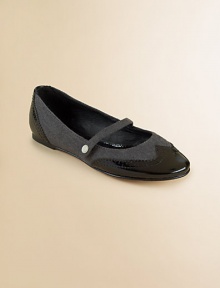 Charming Mary Janes flats are crafted in shiny patent leather with wool in a wingtip silhouette.Slip-on with top strapPatent leather and wool upperLeather liningLeather soleImported