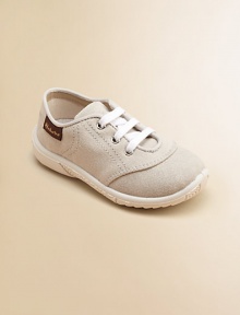 This cozy pair of neutral-hued canvas kicks for your little angel will mix and match with everything.Slip-onCanvas upperCanvas liningRubber solePadded insoleImported