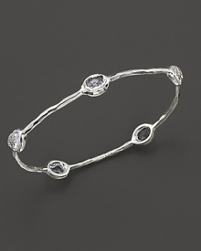 From the Silver collection, five clear quartz stations on a hammered bangle in sterling silver. Designed by Ippolita.