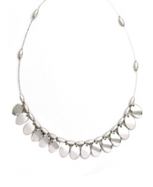 Shake up your look in polished style. Nine West's shimmery shaky necklace highlights reflective silver tone mixed metal discs strung from a delicate beaded chain. Approximate length: 16 inches.