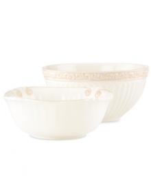 Two of a kind, Butler's Pantry serving bowls add a vintage touch to every gathering. With embossed vines and fluting in one and scalloped detail on the other, this graceful pair shares a soft, feminine look and superior Lenox craftsmanship.