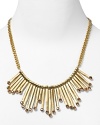 Strike gold with this plated bib necklace from Aqua, accented by angular bars and inset blush crystals. It's neo-tribal look demands to be worn with bold colors and prints.