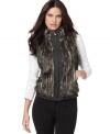 Calvin Klein's reversible vest does double time with chic faux fur on one side and classic plaid on the other.