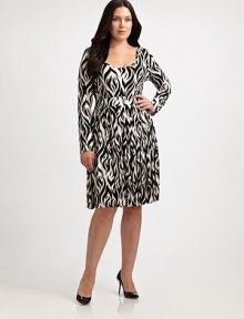 Designed to turn heads, this stretch-modal dress features an alluring scoopneck and an intriguing print. Its long sleeves provide arm coverage as its banded waist will comfortably define your silhouette.ScoopneckLong sleevesPull-on styleAllover printElasticized waistPleated skirtAbout 63 from shoulder to hem92% modal/8% spandexDry cleanMade in USA