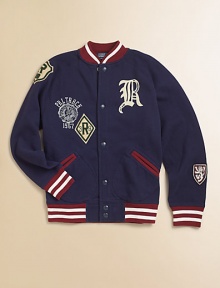 A traditional varsity jacket is accented with contrasting stripes, applied numbers and collegiate patches for a heritage look.Stand collarLong sleevesSnap-frontSide slash pocketsRibbed cuffs and hemCottonMachine washImported Please note: Number of snaps may vary depending on size ordered. 