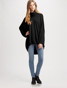 Dramatically oversized sweater of pure wool has a slouchy turtleneck, long dolman sleeves and a hi-lo hem. TurtleneckDropped shouldersLong dolman sleevesHi-lo hemBody: WoolDry cleanImportedModel shown is 5'10 (177cm) wearing US size Small.