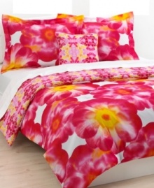 The Sasha three-piece comforter set features a striking collection of purple and orange blossoms contrasted with a reversible kaleidoscope graphic. The combination of floral and geometric shapes creates a fun, feminine look for contemporary bedding. (Clearance)