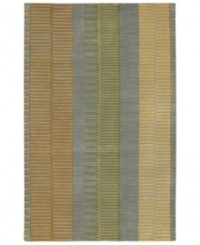 Add urban flair to your pad with Surya's contemporary rug from the Artist Studio collection. Muted yellow, sage green and rust tones are styled in a grid motif against the slate grey background for a low-key, hip result. Crafted from dense wool pile, the Artist Studio rug offers a uniquely textured feel that is incredibly soft to the touch.