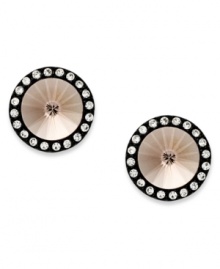 These stud earrings from Juicy Couture are crafted primarily from silver tone brass with a titanium post, and feature glass accents around the border for that extra bit of shine. Approximate diameter: 1/2 inch.