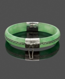 Effortless and chic, this simple slip-on style creates a look of polished elegance. A Greek-key pattern adds character to this solid jade bangle (10-1/2 mm-13 mm). Accents and clasp crafted in sterling silver. Approximate diameter: 2-1/4 inches.