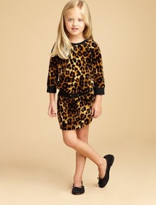 A bold leopard print adds a flash of brilliance to this three-quarter sleeve velour frock with drawstring waistband and slash pockets.CrewneckThree-quarter raglan sleevesPullover styleElastic & drawstring waistbandFront slash pocketCotton/PolyesterMachine washImported