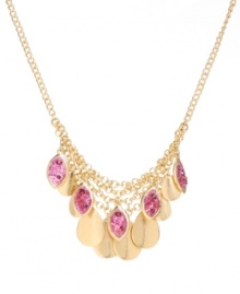 A swoop of statement-making sparkle. Kenneth Cole New York's chic cluster frontal necklace combines polished discs and crushed purple glass charms in gold-plated mixed metal. Approximate length: 16 inches + 3-inch extender. Approximate drop: 1-1/2 inches.