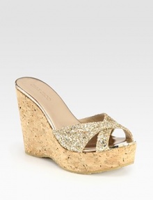 Raise the bar wearing this glittery staple with elegantly crisscrossed straps and a powerful cork wedge. Cork wedge, 4½ (115mm)Cork platform, 1½ (40mm)Compares to a 3 heel (75mm)Glitter-coated fabric and metallic leather upperMetallic leather liningRubber solePadded insoleMade in Spain