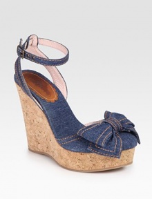 Secured by an adjustable ankle strap, this stretchy denim style is updated by a bow-adorned closed toe and cork wedge. Cork wedge, 5Cork platform, 2Compares to a 2 heelDenim upperDenim liningLeather solePadded insoleMade in ItalyOUR FIT MODEL RECOMMENDS ordering one half size up as this style runs small. 