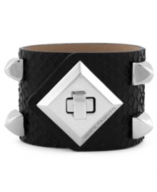 Rough and ready style from Vince Camuto. This chic cuff bracelet features silver tone stud and turnlock details. Crafted with black snake-embossed leather. Approximate length: 8-1/2 inches. Approximate diameter: 2-1/2 inches.