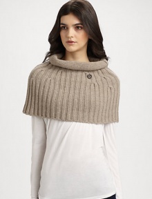 A plush, knit wool and cashmere topper with rolled collar in a cozy, cropped silhouette.About 15 X 1770% wool/30% cashmereDry cleanMade in Italy