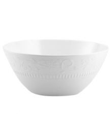 As durable as it is elegant, Mikasa's Countryside Scroll vegetable bowl features classically designed, chip-resistant bone china embossed with delicate scrolling vines and fluted detail. A pure white glaze makes it suitable for every day, any occasion.