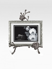 A two-piece easel-style frame finds inspiration in the textures of nature, crafted in hammered and blackened nickel-plated metal by one of America's premier metalwork artists. From the Black Orchid CollectionOverall, 8 X 10½Accommodates a 4 X 6 or 5 X 7 photographImported 