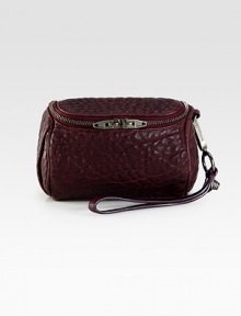 Luxurious textured leather with a convenient wrist strap.Wrist strap, 6½ dropTop zip closureFully lined6W X 4H X 4DImported