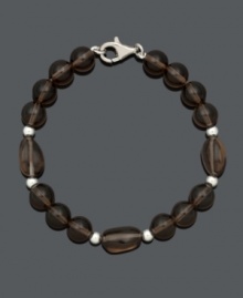 Slip into neutral style for a subtle finishing touch. This chic bracelet features 8 to 9 mm smokey quartz beads (75 ct. t.w.) with sterling silver accents and setting. Approximate length: 7-1/2 inches.