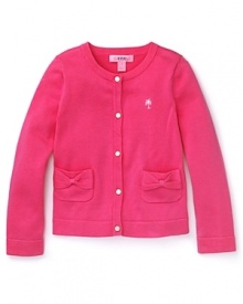 Pink and pretty with bright white buttons and pocket bow details, this Lilly Pulizter cardigan's sure to be her go-to girly sweater.