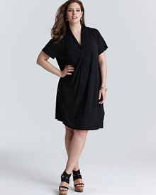 Exercise restrained minimalism with this Calvin Klein Plus tee shirt dress. An elegant knotted neckline finishes a clean silhouette for a versatile closet essential.