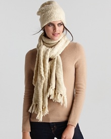 Bundle up in style. A chunky handknit hat with fleece inner lining and a slouchy silhouette.