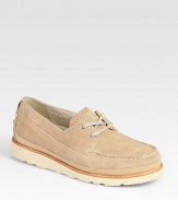 Crafted with boat-shoe inspired styling, this casual lace-up design is highlighted by contrast rubber sole and stitching.Suede upperLeather liningPadded insoleRubber soleImported