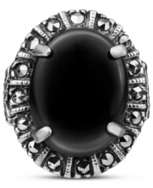 Punctuate your look. This bold, oval-shaped ring highlights a black onyx gemstone (4-3/4 ct. t.w.) surrounded by glittering marcasite (1/4 ct. t.w.) in sterling silver. Size 7.