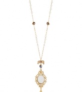 Who's the fairest of them all? You, with this necklace from Betsey Johnson. Crafted from gold-tone mixed metal, the necklace features a mirror pendant at the center, with beads and crystal accents for added shine. Approximate length: 29 inches + 3-inch extender. Approximate drop: 5-1/4 inches.