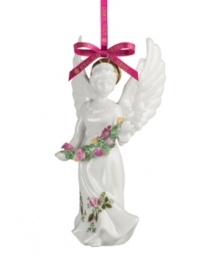 If you love it on your table, you'll adore it on the tree. This serene angel ornament spreads its wings with the classic pink and gold florals of Royal Albert's famed Old Country Roses dinnerware collection.