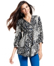 Flecks of cobalt add another element to this black-and-white animal-print blouse. Flawless when paired with skinny pants in the same hue!