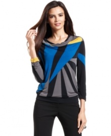 Alfani's latest petite top combines a graphic print with flattering elements, like a cowl neckline and ruched cuffs.