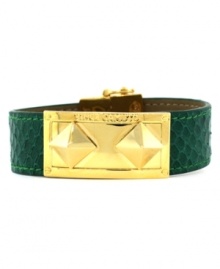 Style meant to make a fierce statement. Vince Camuto's chic snap bracelet combines snake-embossed green leather and a gold tone mixed metal pyramid-stud plate and closure. Approximate length: 8 inches.