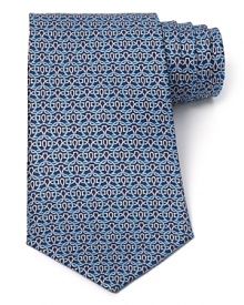 Intricately patterned with a host of Gancini logos, this robust tie from Salvatore Ferragamo finishes your professional ensemble with top-notch quality.