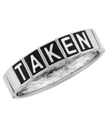 Tell your many admirers that you're off the market. BCBGeneration's trendy stretch bracelet features the word TAKEN in black enamel stenciling. Set in silver tone mixed metal. Bracelet stretches to fit wrist. Approximate diameter: 3-1/2 inches.