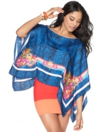 In an on-trend poncho style, this BCBGMAXAZRIA floral & python printed top is perfect for a bold spring look!