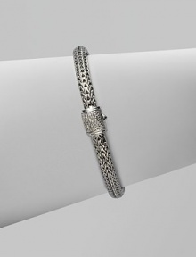 Diamond clasp accents sterling silver and 18K white gold chain bracelet. Pavé diamond, 0.17 tcw Push button close 7½ long Hand made in Bali