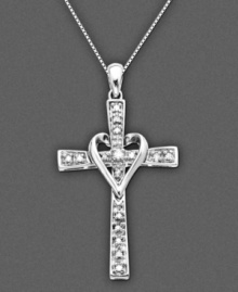 A diamond heart cross: the ultimate expression of love. This pendant features round-cut diamond (1/10 ct. t.w.) set in 14k white gold. Approximate length: 16 inches. Approximate drop: 1-1/4 inches.