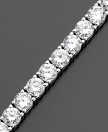 Grace your wrist with a never-ending circle of beautiful round-cut cubic-zirconia (10 ct. t.w.). This tennis bracelet by CRISLU is set in sterling silver finished in platinum. Approximate length: