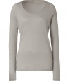 Ground your cool weather casual wardrobe with stylish staples like this light grey long sleeve t-shirt from Closed - Crafted from super-soft, pure cotton and gently distressed for a look of well-worn chic - Long, lean cut, hits below hips - Fitted sleeves and flattering scoop neck - Wear solo or layer with a blazer or pullover and pair with cigarette pants, jeans or A-line skirts