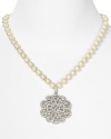 Give into glamour with Carolee's sparkling pearl necklace. With an ornate crystal pendant, this strand vows to wow.