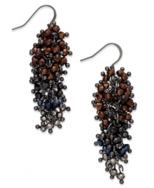 A waterfall of alluring glass beads from c.A.K.e. by Ali Khan. These drop earrings feature clusters of faceted rondelles in a hematite tone mixed metal setting. Approximate drop: 2 inches.