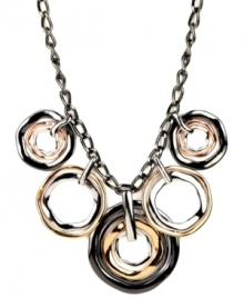 A mixture of bent metals adds a sense of edginess to the Shaky Frontal necklace by Nine West. Made of silver, rose gold, and hematite-plated mixed metal. Approximate length: 16 inches + 2-inch extender. Approximate drop: 1-3/4 inches.