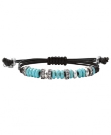 Wrap up your style with a subtle layer. Fossil's trendy bracelet comes on a chocolate brown leather cord and features clear crystal beads and faceted reconstituted turquoise. Set in silver tone mixed metal. Bracelet adjusts to fit wrist. Approximate diameter: 2-1/2 inches.